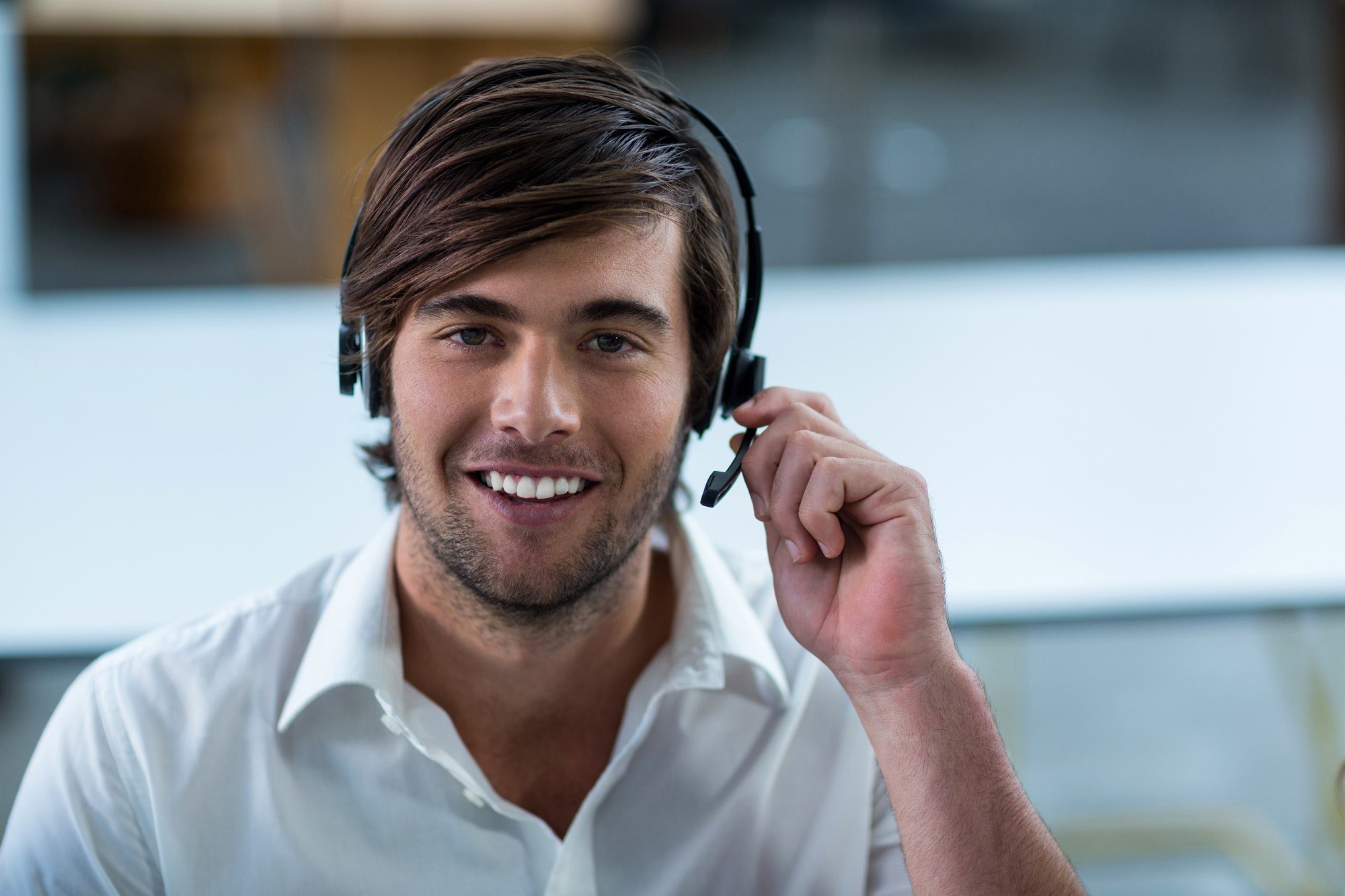 Male Medicare Agent on a headset shopping with multiple Insurance companies.