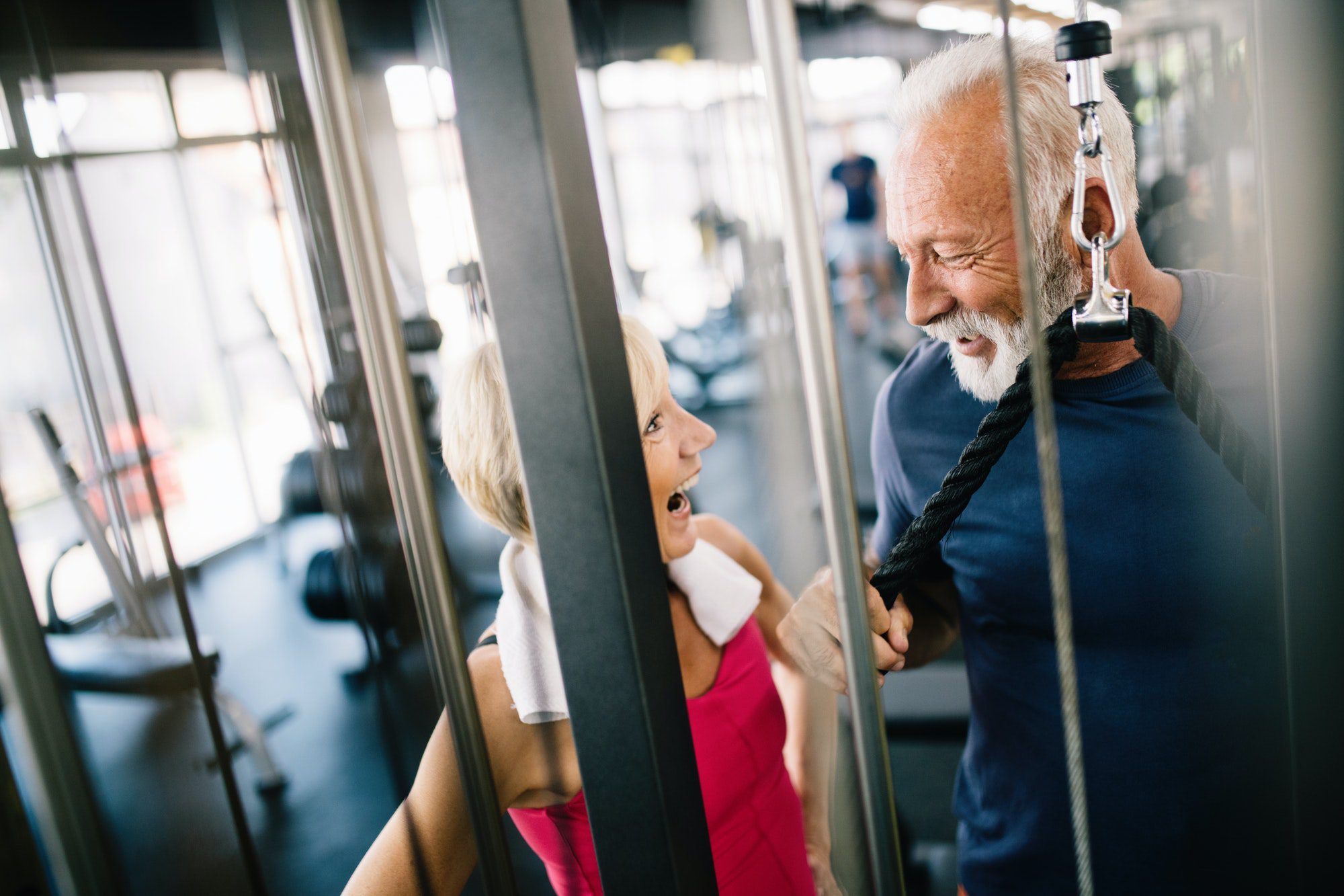 Couple at a Gym enjoying their Medicare Medical Savings account that offers benefits like a gym membership.