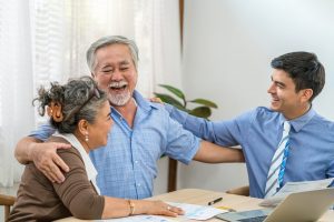 Asian couple excited with the Medicare Plan that their Medicare Agent got them.