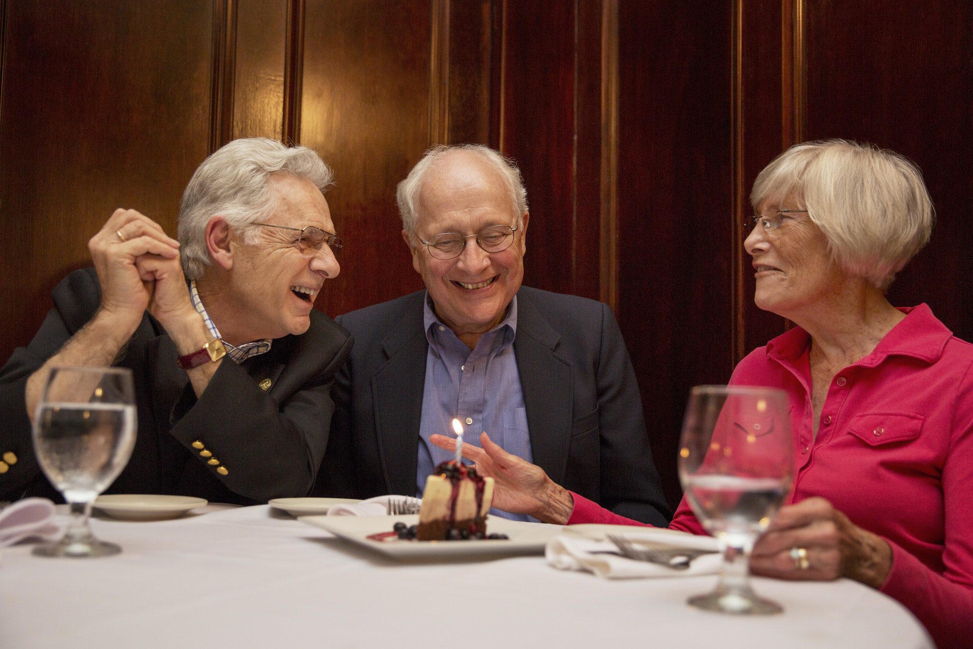 Senior friends enjoying dinner as they discussed Medicare Advantage Plans.